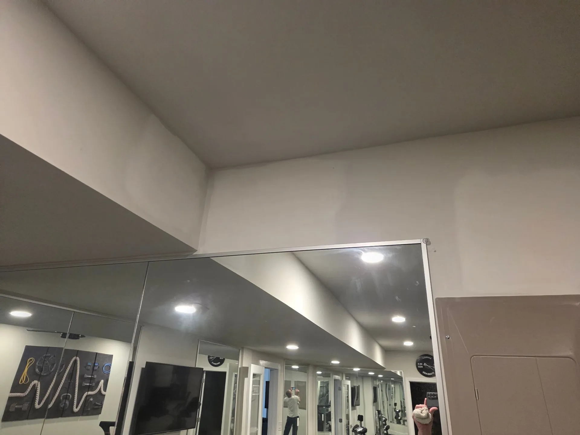 Drywall finished and sanded in Haymarket, Virginia after an EV charger installation, with the main electrical panel located in the basement