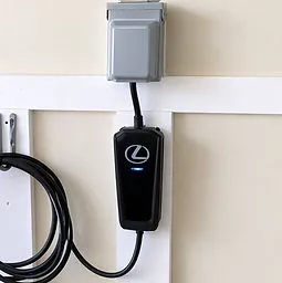 Plug-in EV charger installed near a garage outlet