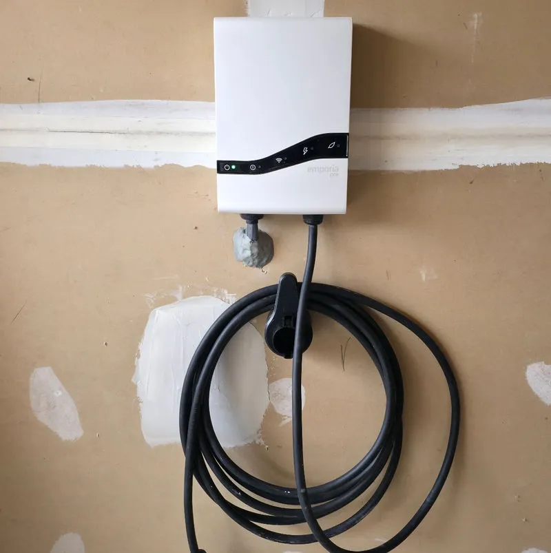 Hardwired Level 2 electric vehicle charger with a clean cable route